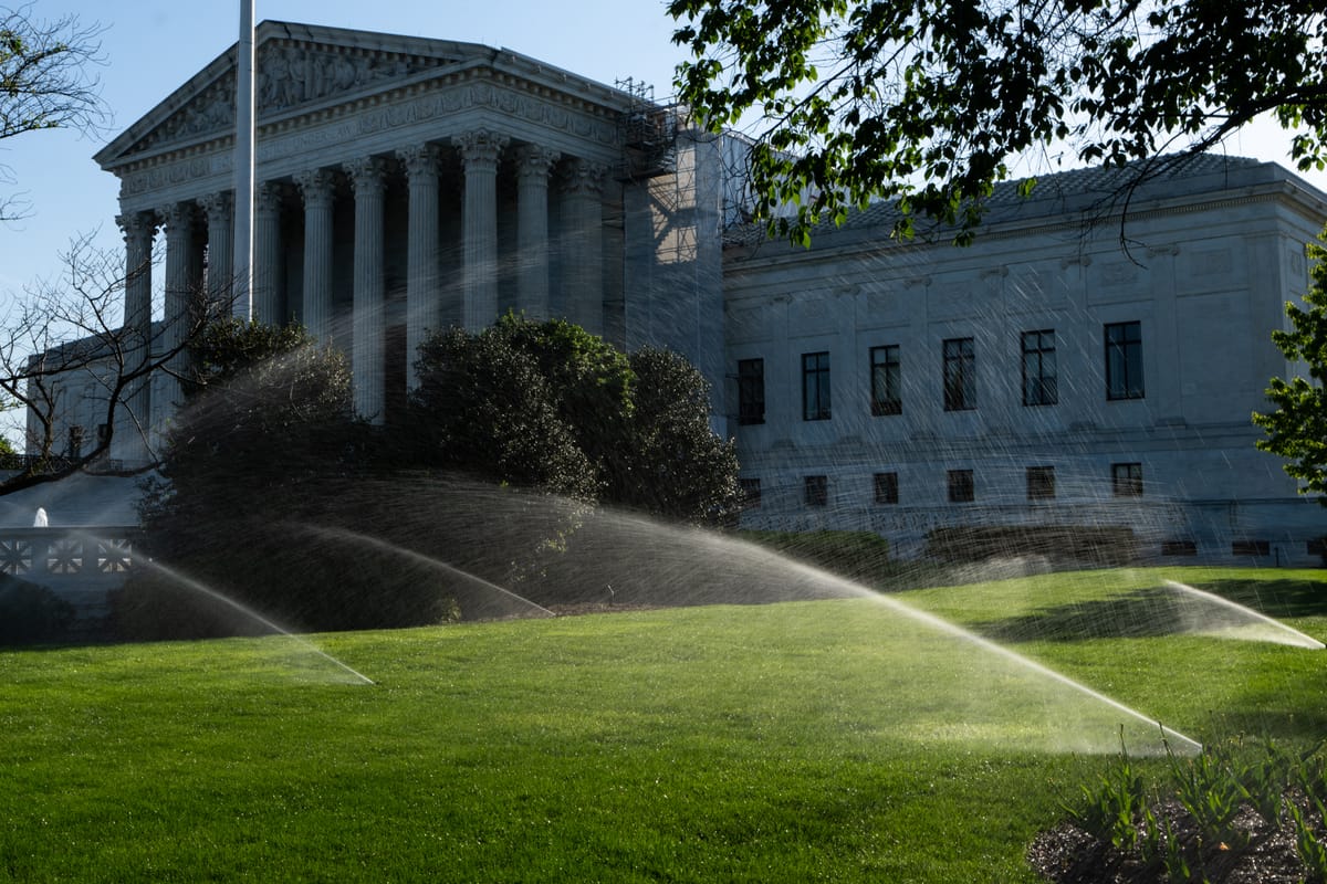 Sprinklers water the lawn in front of the U.S. Supreme Court last month