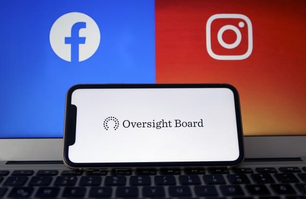 Oversight Board logo is seen on a smartphone with Facebook and Instagram logos. (Hakan Nural / Getty Images)