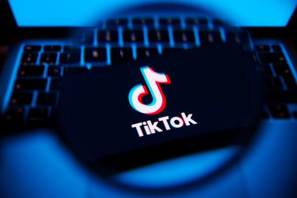 TikTok logo is screened on a mobile phone for illustration photo