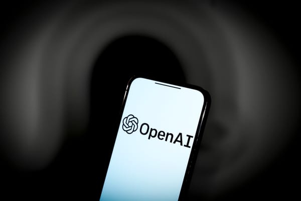 A photo of the OpenAI logo on a smartphone