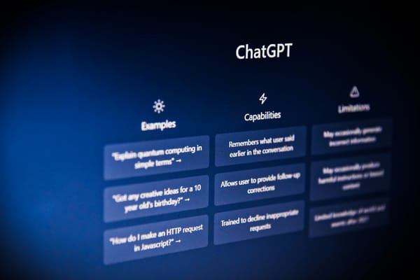 A ChatGPT marketing screen, showing a grid of example prompts, capabilities and limitations