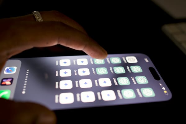 A smartphone screen shows a full page of ChatGPT and Gemini apps