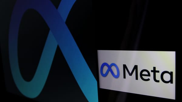 The Meta logo at an angled profile against a black backdrop next to a smartphone on its side showing the logo and wordmark