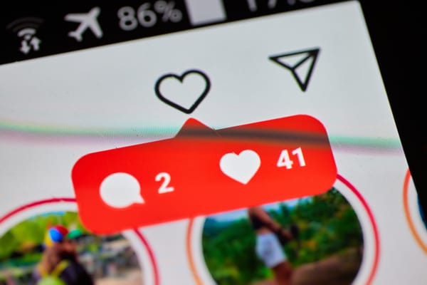 A close-up of a notification showing new messages in Instagram, shown on a smartphone